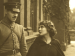 Mary Pickford looking at a man in military uniform.