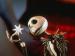 Jack Skellington holding a star ornament.