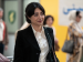 A woman smiling in an airport.