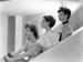 Joan Crawford, Norma Shearer and Rosalind Russell sitting in profile.