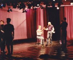 In the Life host Kate Clinton (left), actor David Drake (seated, center), In the Life director Bob Diamond (standing, center). Ep. 202. 1992. Credit: Charles Ignacio.