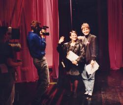 In the Life line producer Hilery Joy Kipnis (waving, center) and host Kate Clinton (right). 1992. Credit: Charles Ignacio.