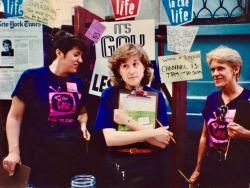 Volunteers Trish Cosgrove (center) and R. Katherine Brady (right) staffing the In the Life street booth at NYC Pride Festival. 1992. Credit: Charles Ignacio.