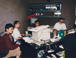 In the Life staff working on ep. 309 ("Stonewall 25), left to right: production coordinator Desireena Almoradie, associate producer Ben Prayz, producer Charles Ignacio, executive producer John Scagliotti. 1994. Credit: John Catania.